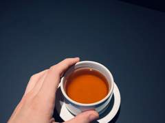 Black tea, pen, book