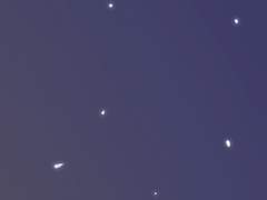 * A hooded figure watches the commontion from afar.